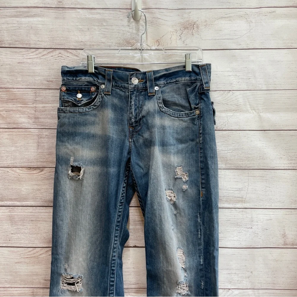 TRUE RELIGION STRAIGHT FLAP DISTRESSED JEANS‎